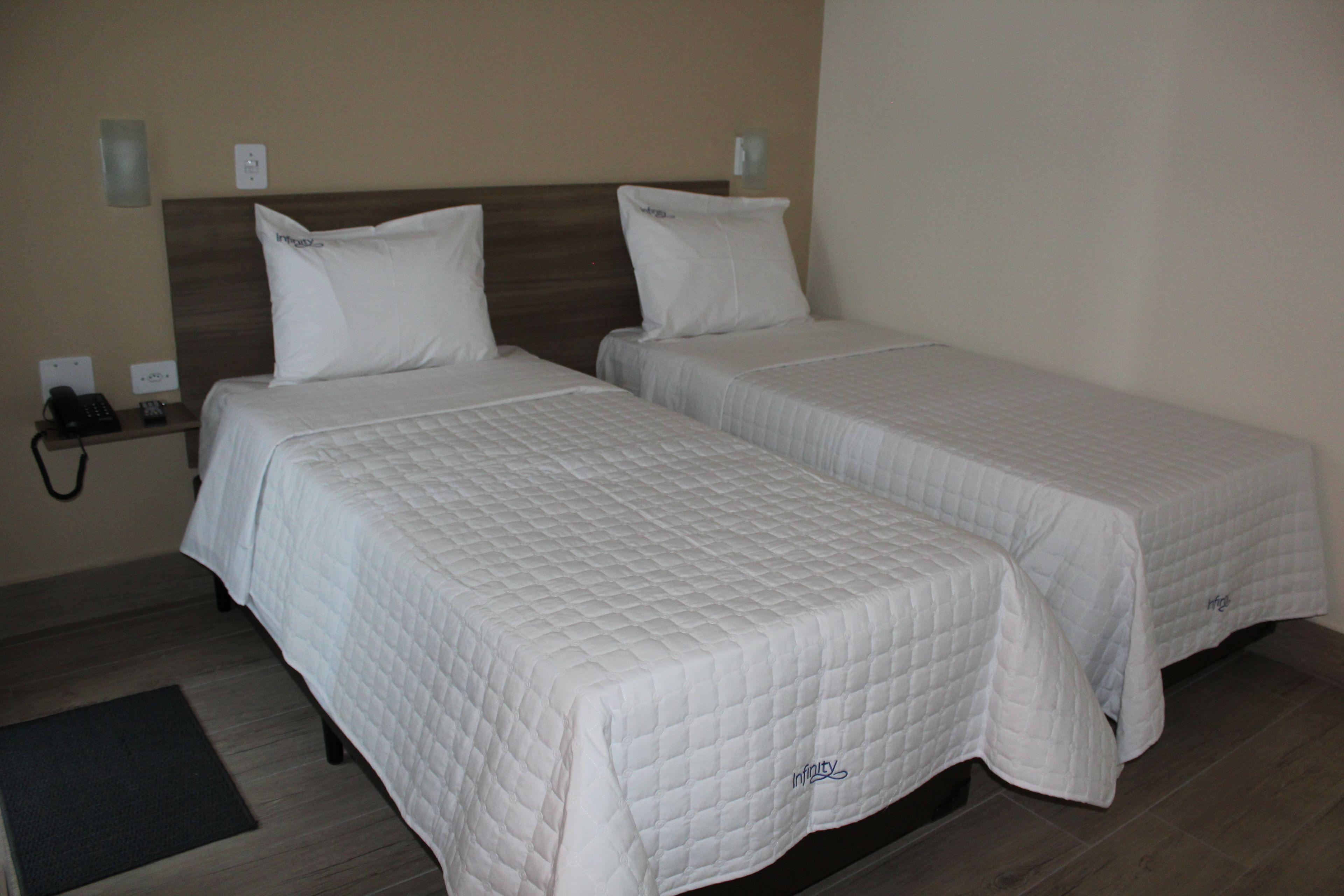 room, 2 single beds | desk, laptop workspace, blackout curtains, iron/ironing board