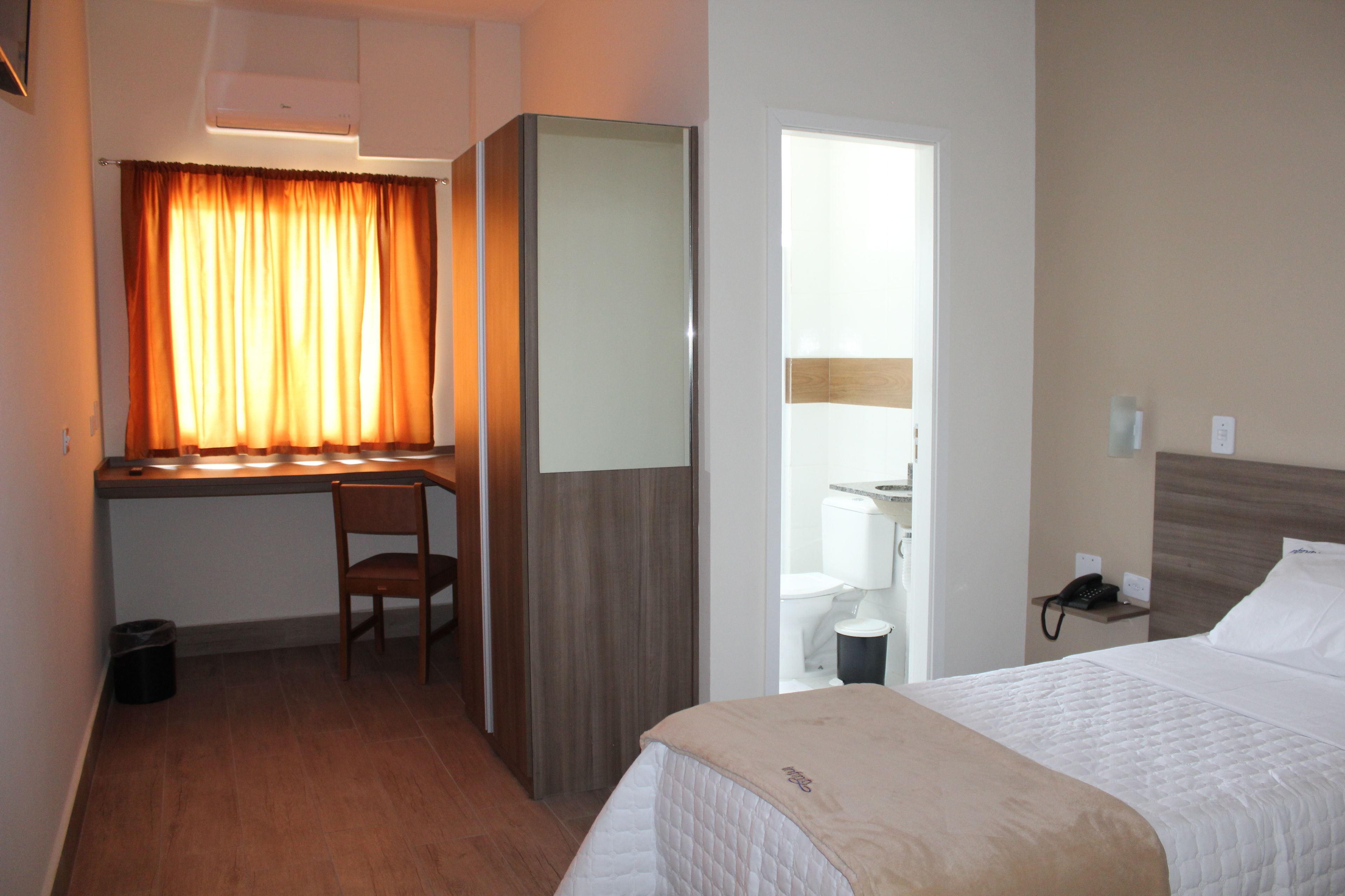 basic single room | desk, laptop workspace, blackout curtains, iron/ironing board