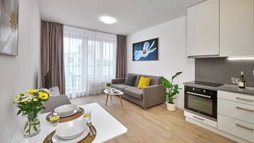 Exclusive Apartment, 1 Bedroom, Balcony, City View | Living area | Flat-screen TV