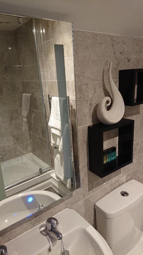 Shower, free toiletries, hair dryer, towels