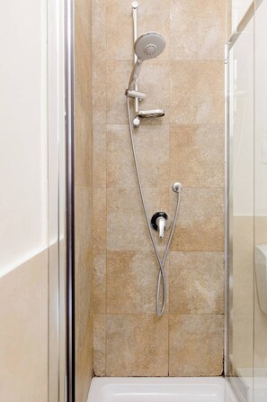 Standard Double Room | Bathroom | Shower, hair dryer, bidet, towels
