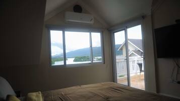 Luxury Apartment, 2 Bedrooms, Ocean View, Beachfront | 1 bedroom, in-room safe, desk, iron/ironing board