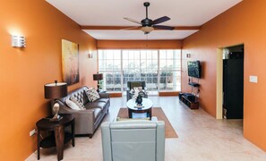 Family Apartment, 2 Bedrooms, Beach View, Beachfront | Living area | Flat-screen TV - Paradise  Beach Front Apartment (Discovery Bay)