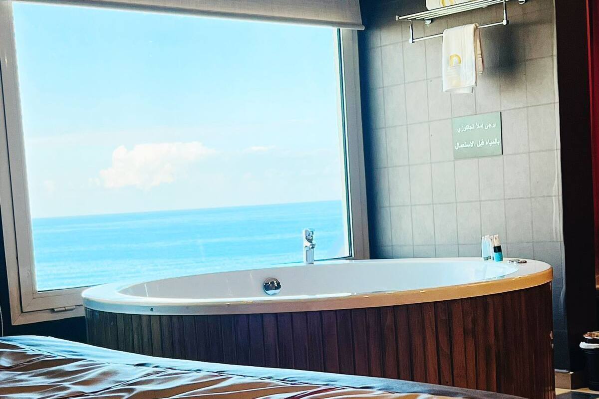 Junior suite with Jacuzzi balcony and sea view | Premium bedding, minibar, desk, laptop workspace