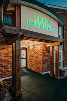 Entrada de hotel con un letrero que dice "hotel pommier".