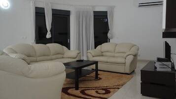 Apartment, 4 Bedrooms | Living room | TV