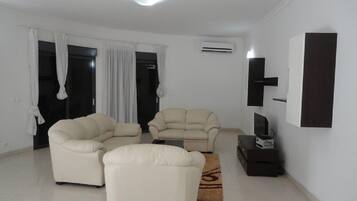 Apartment, 4 Bedrooms | Living area | TV