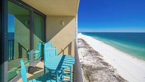 A balcony with a view of a beach and ocean. - Phoenix All Suites West Hotel Unit 301 (Gulf Shores)