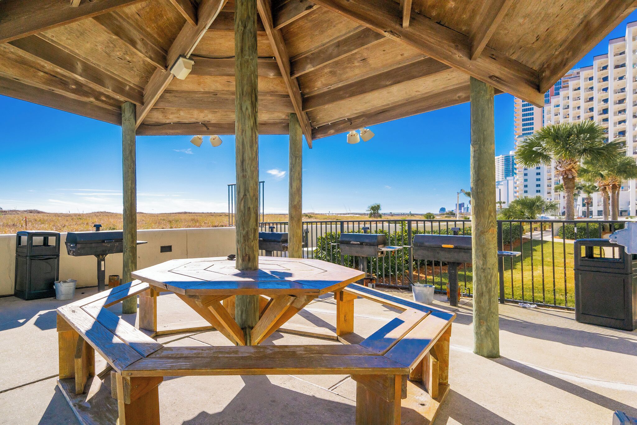 Gather around the shaded picnic area with grills, perfect for a fun barbecue while taking in the beautiful beachfront views