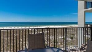 A balcony with a view of a beach and ocean. - Reserved Parking Space! 2 BR Gulffront! Phoenix VI 6710 (Orange Beach)