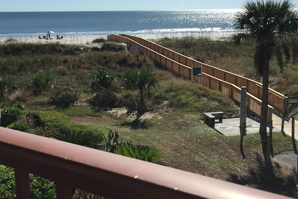Balcony view! New boardwalk to the beach from our building.
