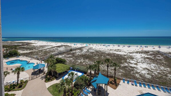 A resort with multiple swimming pools, a beach, and a clear view of the ocean. - Fifth Floor Condo @ Phoenix East ~ 2BR 2BA (Orange Beach)