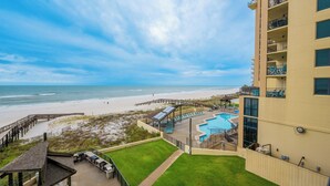 A beachfront hotel with a swimming pool, beach access, and a view of the ocean. - **3rd Floor ~ 2 Bedroom at Phoenix II** (Orange Beach)