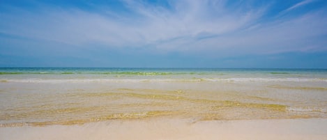 A beach with clear skies and calm waters.