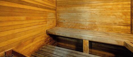 A sauna with wooden benches and a bench seat.