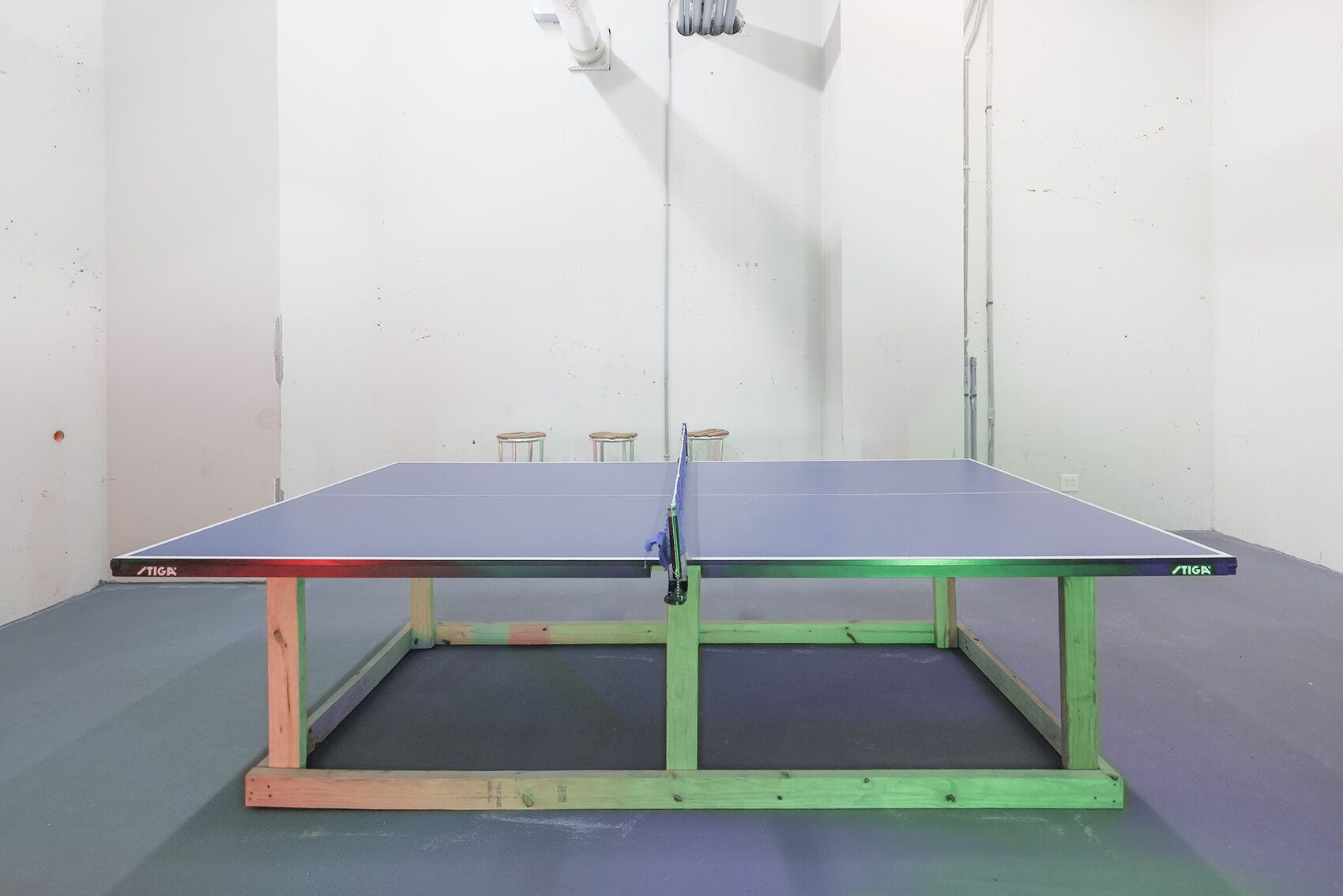 Challenge your friends to a fun game of ping pong in this spacious recreational area, perfect for friendly competition