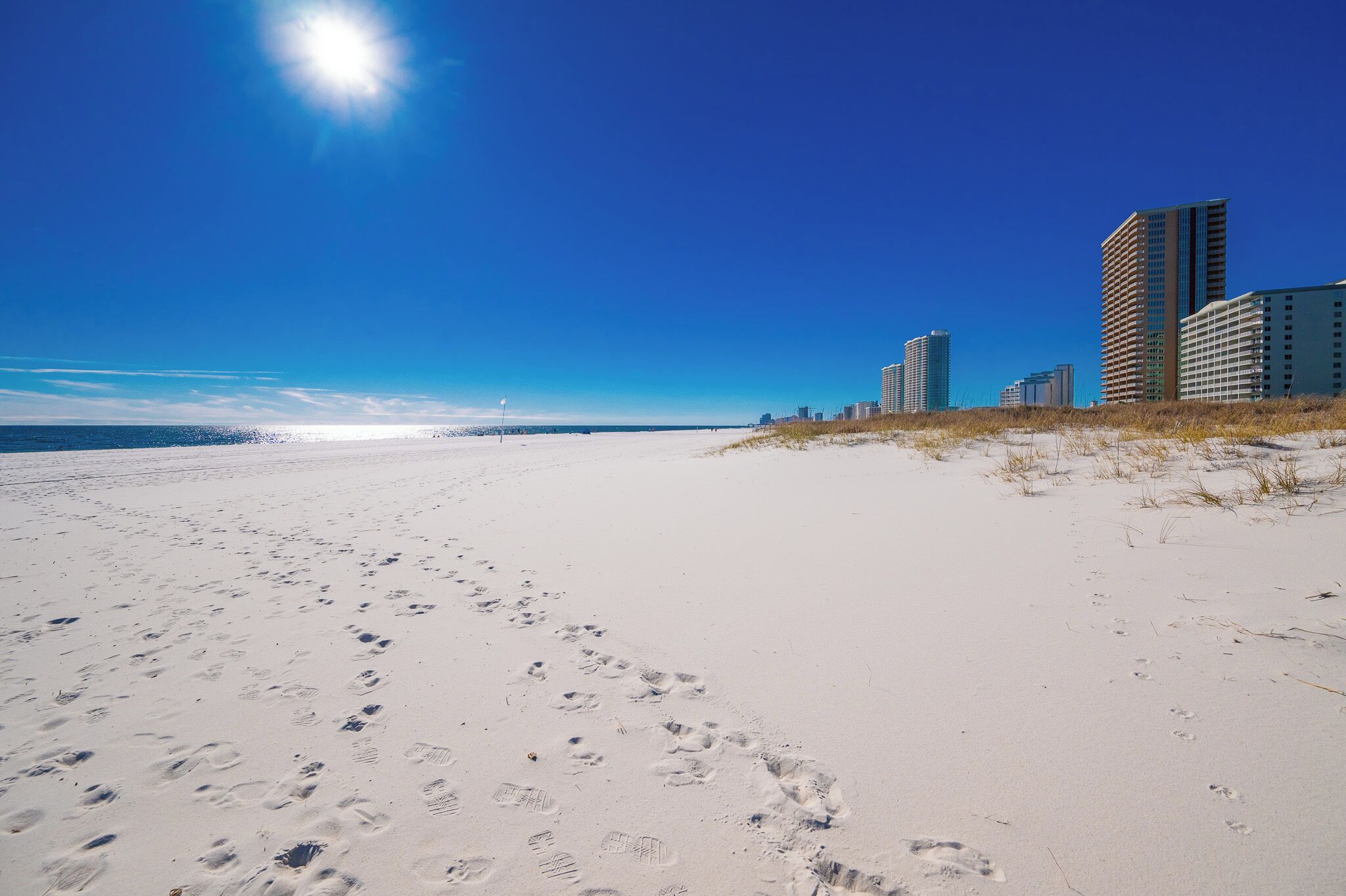 Experience stunning views of the pristine beach and vibrant shoreline from your vacation rental at Phoenix VII