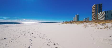 Experience stunning views of the pristine beach and vibrant shoreline from your vacation rental at Phoenix VII