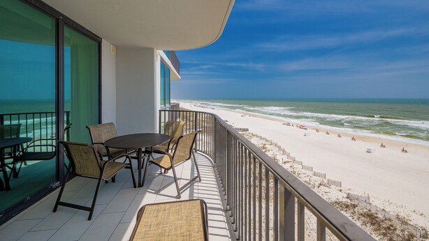 A balcony with a view of the beach and ocean. - *Two Bedroom Gulf Front Condo at Phoenix 9* (Orange Beach)