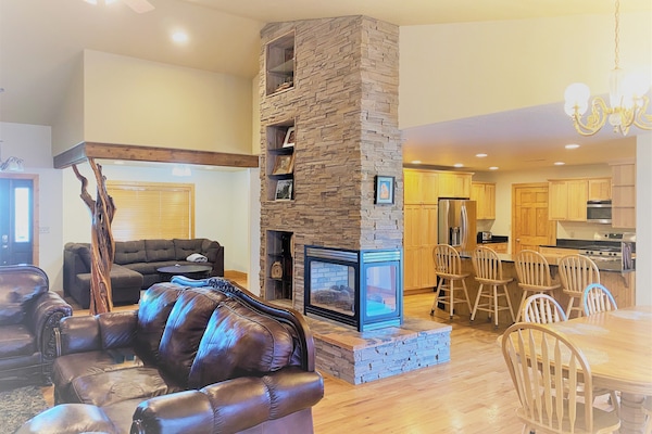 Spacious Open Floor Plan with Kitchen and Two Living Areas and Fireplace
