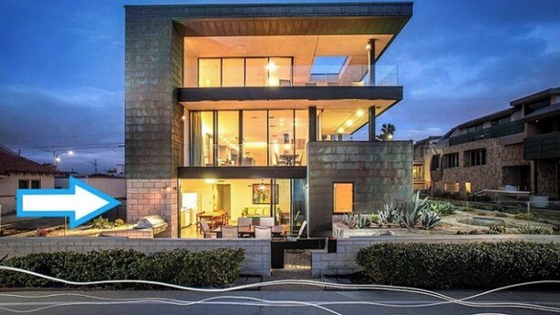 A modern two-story house with a visible dining area and a large window overlooking the garden. - Indoor/Outdoor living on the ocean front. (San Diego)