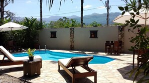 Outdoor pool, pool umbrellas, pool loungers