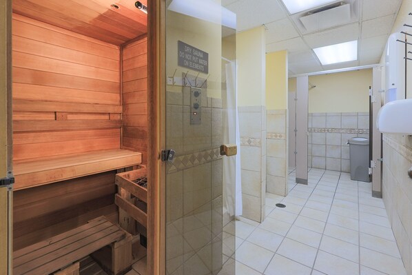 A dry sauna with a wooden bench and a glass door. - Phoenix IV - 4th Floor - 3 Bedroom (Orange Beach)