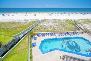 A pool area with a view of the beach and ocean. - Phoenix IV - 4th Floor - 3 Bedroom (Orange Beach)