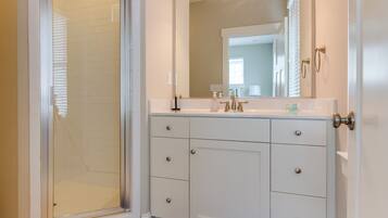 Shower, hair dryer, towels, toilet paper