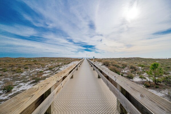 Take the boardwalk to the beach at Phoenix VI and enjoy a fun day on the water