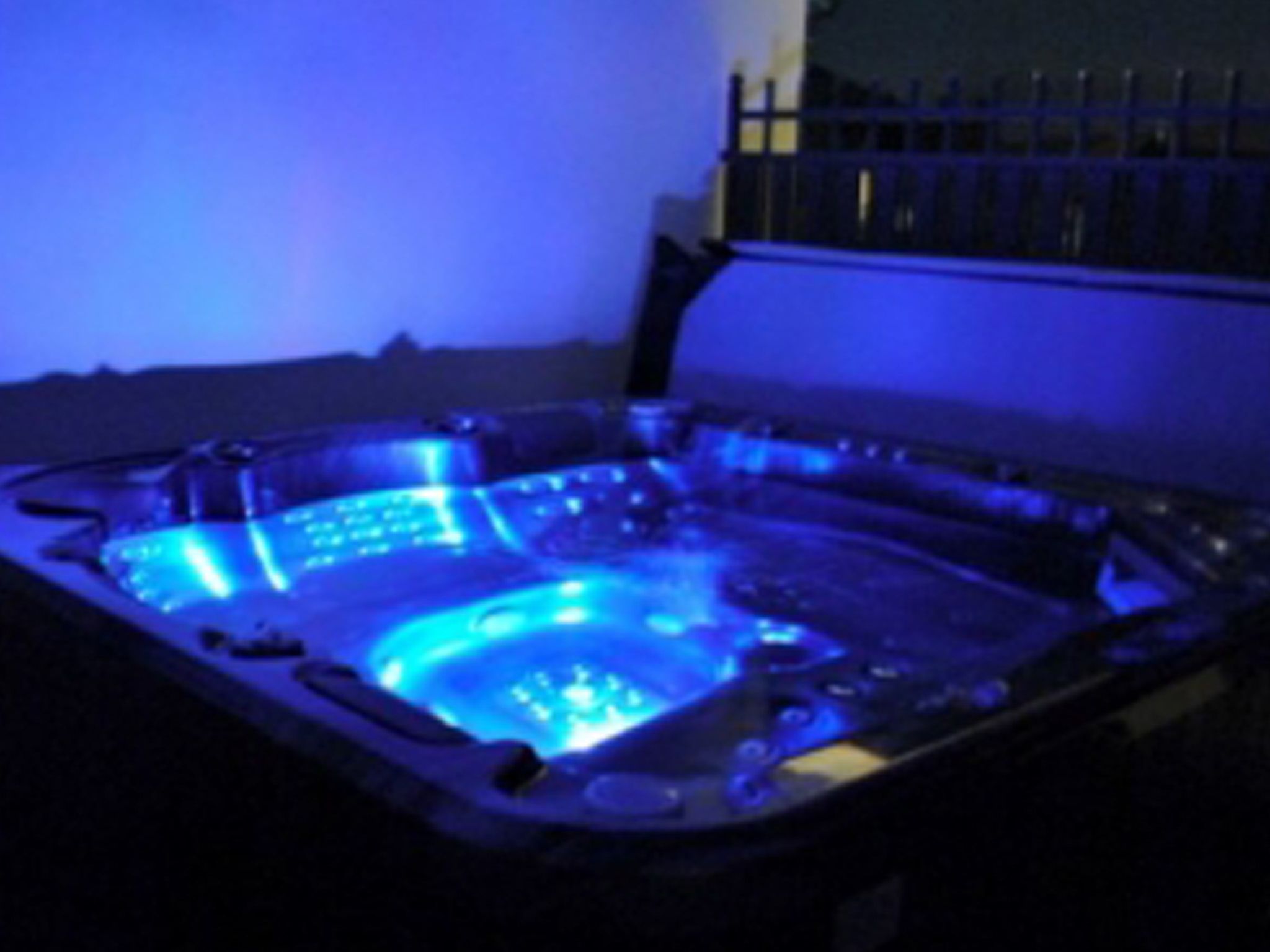 A hot tub with a blue light.