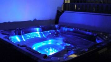 A hot tub with a blue light.