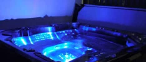 A hot tub with a blue light.