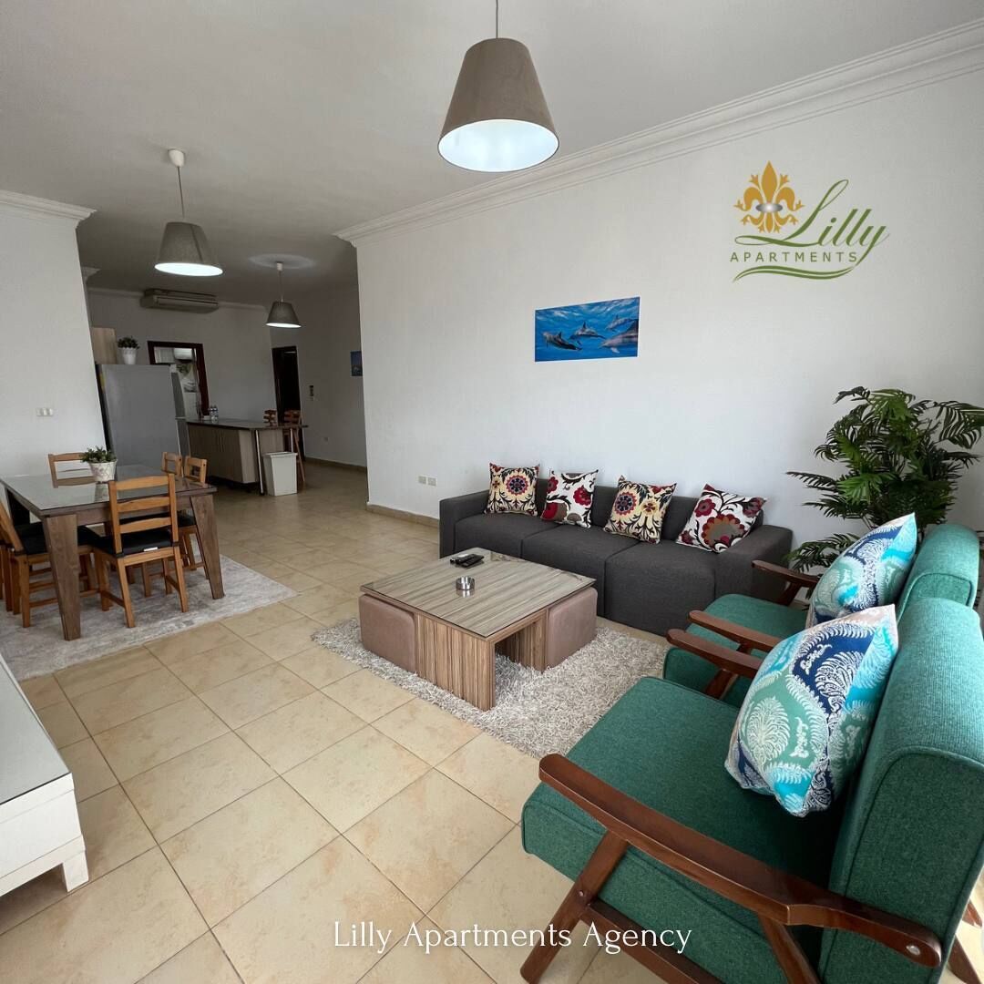 Appartement supérieur, 2 chambres, vue sur la mer | Aire de séjour | Téléviseur ACL de 32 po avec télévision par satellite