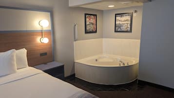 Deluxe Studio Suite, 1 King Bed, Non Smoking | Desk, laptop workspace, blackout drapes, iron/ironing board