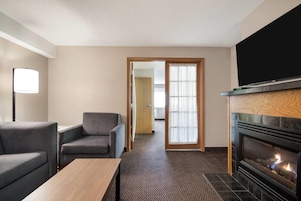 Superior Suite, 1 King Bed, Non Smoking (One-Bedroom Suite) | Desk, laptop workspace, blackout drapes, iron/ironing board