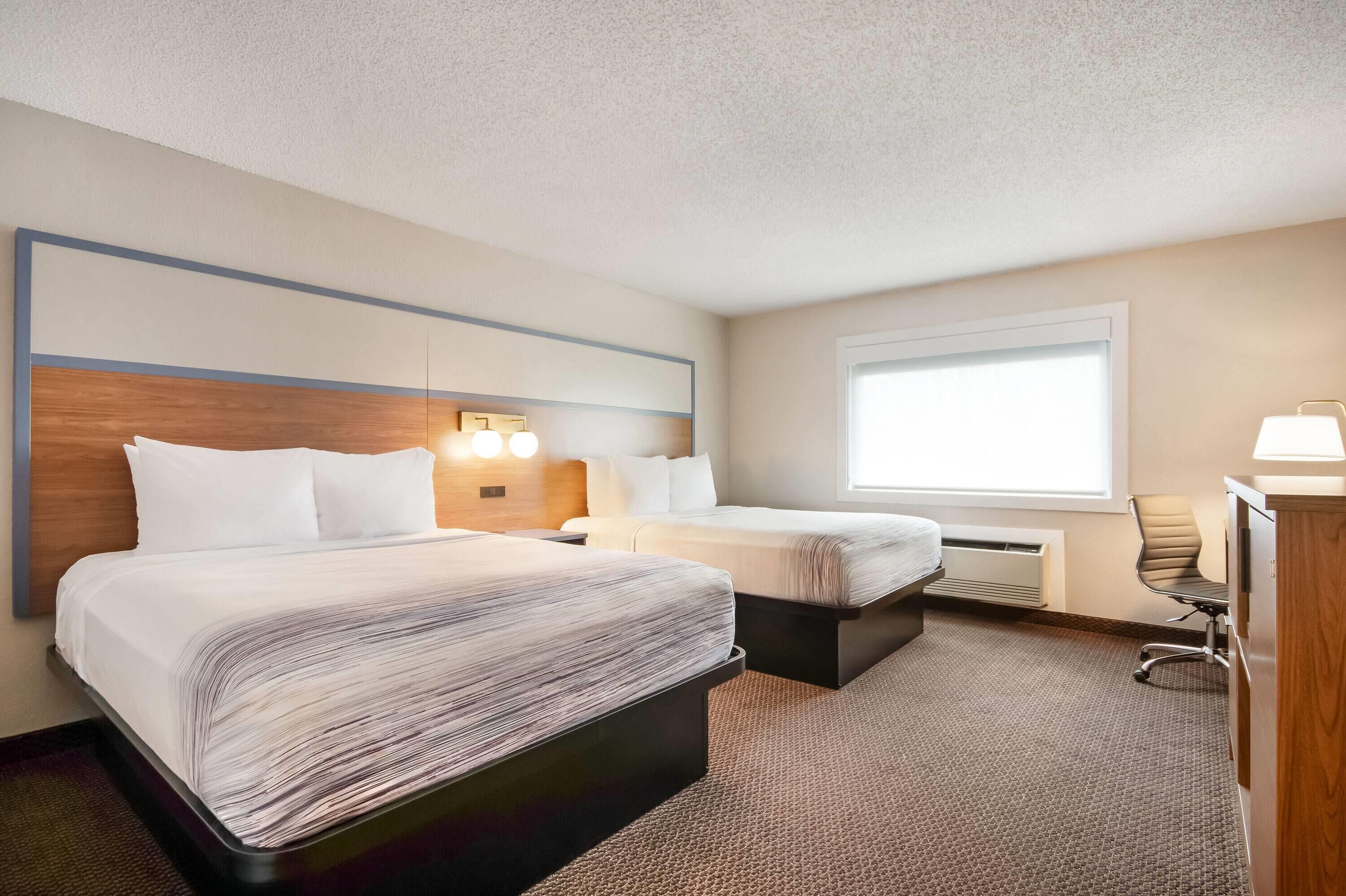 Room, 2 Queen Beds, Non Smoking | Desk, laptop workspace, blackout drapes, iron/ironing board