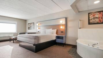 Deluxe Studio Suite, 1 King Bed, Non Smoking | Desk, laptop workspace, blackout drapes, iron/ironing board