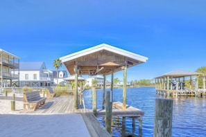 Enjoy waterfront views from the covered dock with a seating area.