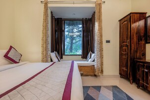 Habitación Deluxe (with AC) | 1 dormitorio, ropa de cama de alta calidad, colchones viscoelásticos