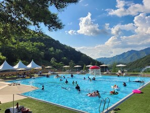 Seasonal outdoor pool, pool umbrellas, pool loungers