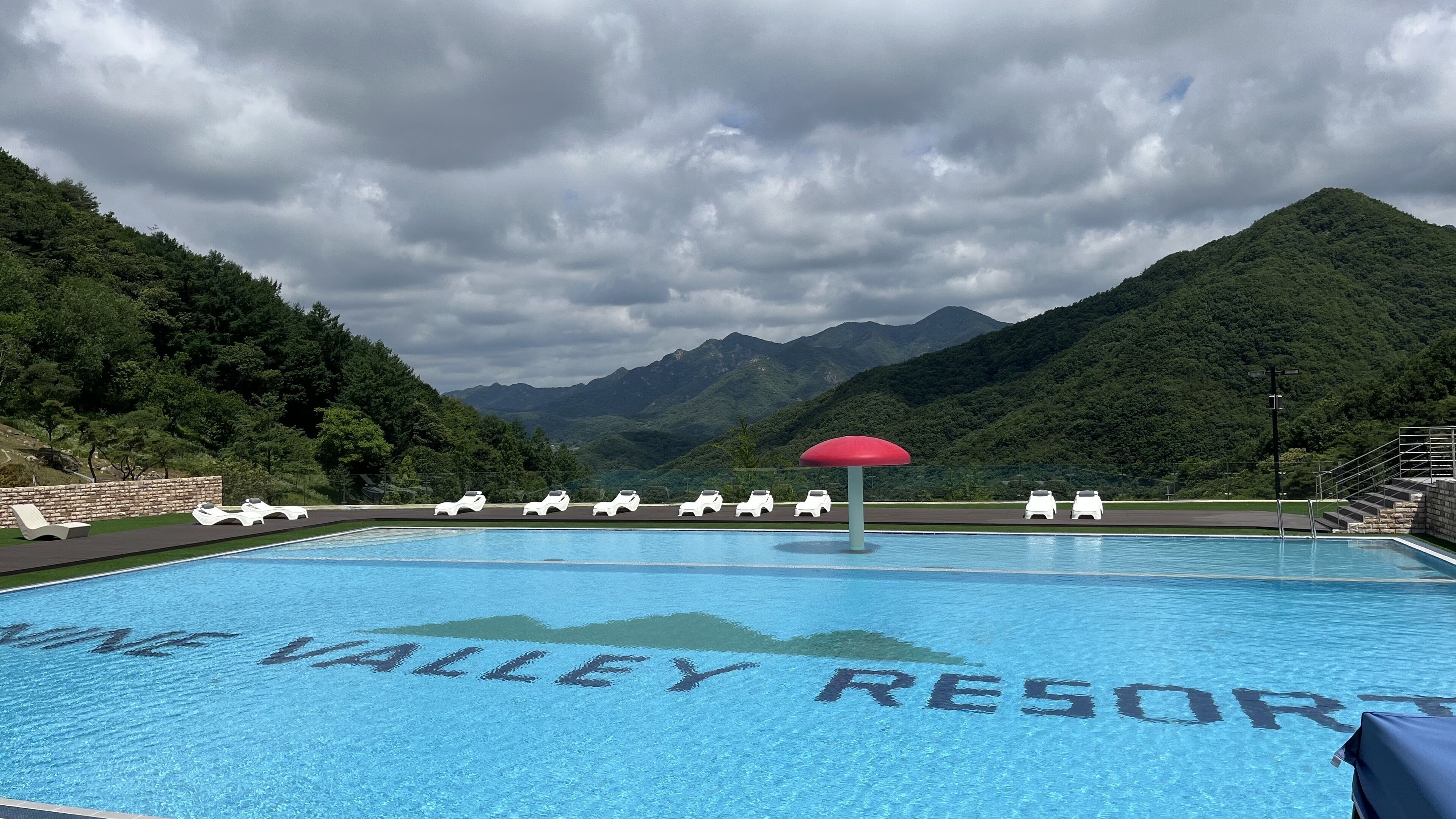 seasonal outdoor pool, pool umbrellas, pool loungers