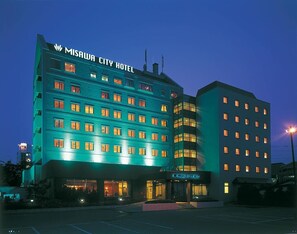 A multi-story hotel with a prominent sign reading "MISAWA CITY HOTEL". - Misawa City Hotel (Misawa)