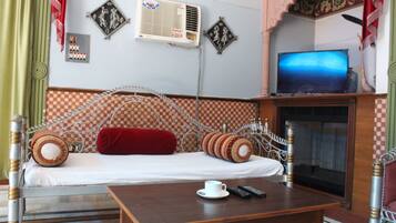 Family Suite, 1 Bedroom, Garden View, Garden Area | Living area | TV
