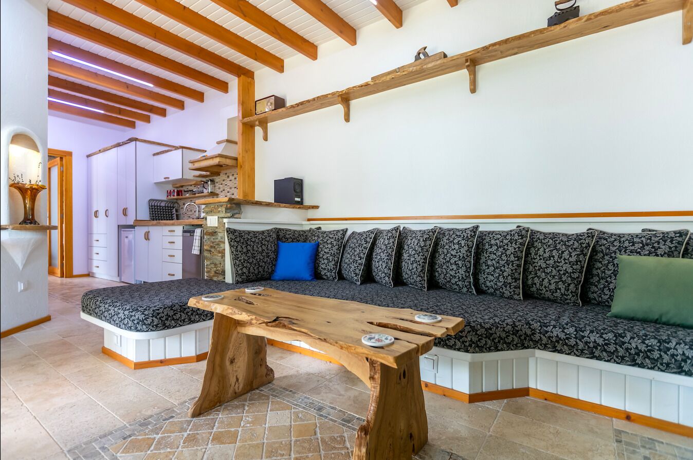 junior chalet, 1 bedroom, non smoking, mountain view | living area | 82-cm led tv with satellite channels, tv, books