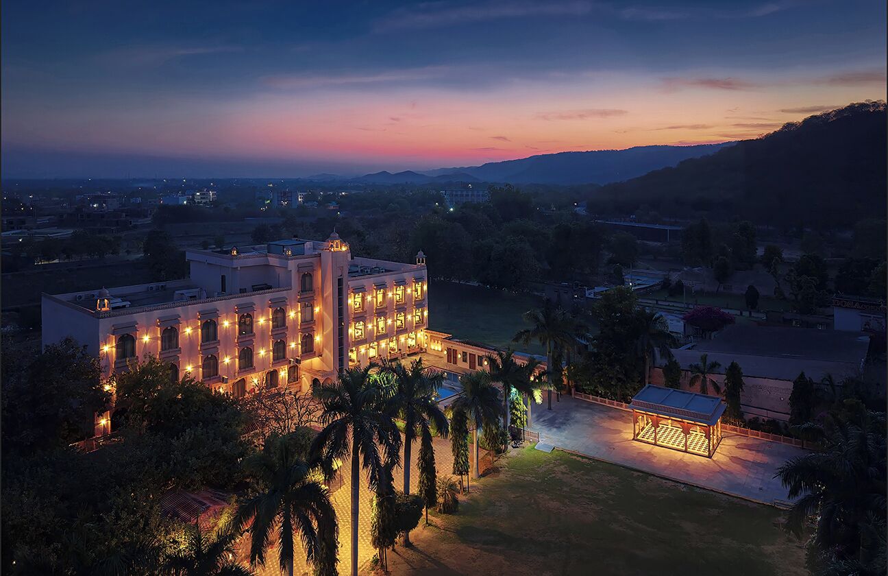 A large, well-lit hotel with multiple floors and a prominent entrance.
