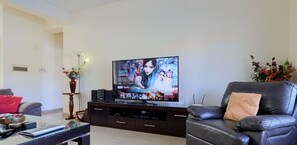 Luxury Villa | Living area | 65-inch LED TV with digital channels, TV, Netflix
