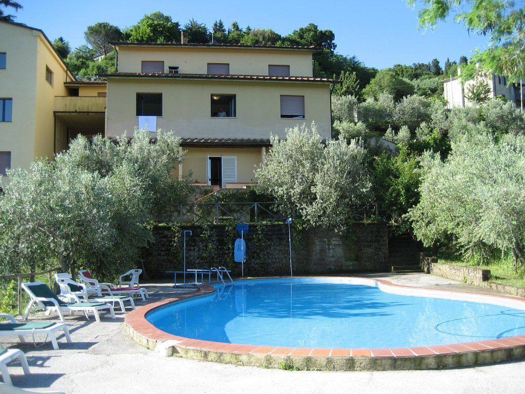 Seasonal outdoor pool, pool umbrellas, pool loungers