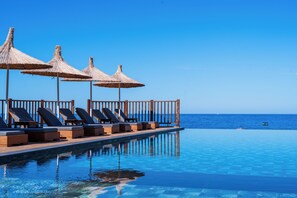 Seasonal outdoor pool, open 9:00 AM to 7:30 PM, free pool cabanas