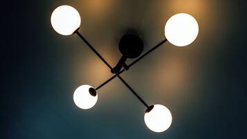 A ceiling with four spherical light fixtures.